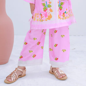 Young girl posing in Zardham Blush Pink three-piece ethnic set, three-quarter angle
