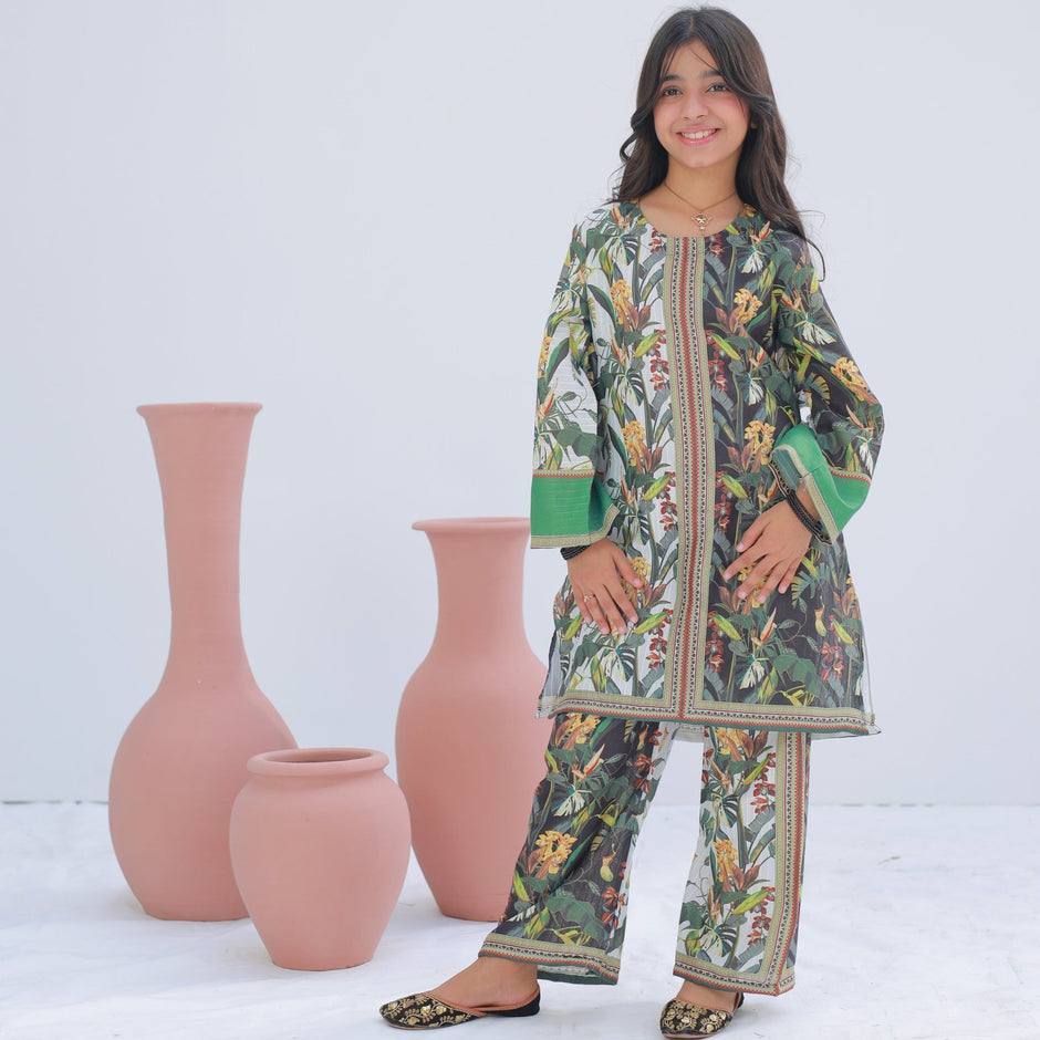 Girl wearing Zardham White & Sage embroidered kurta with sage green trousers, front view