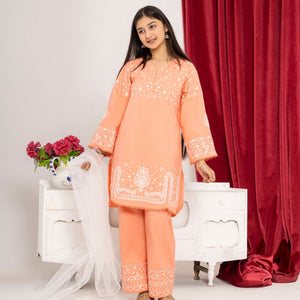 Girl wearing Zardham Blush Coral embroidered kurta and trouser set, full front view