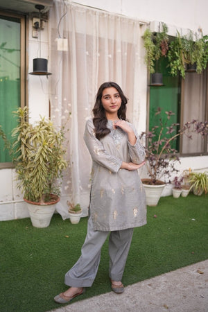 Girl wearing Zardham Stone Grey Tilla embroidered kurta set, full front view