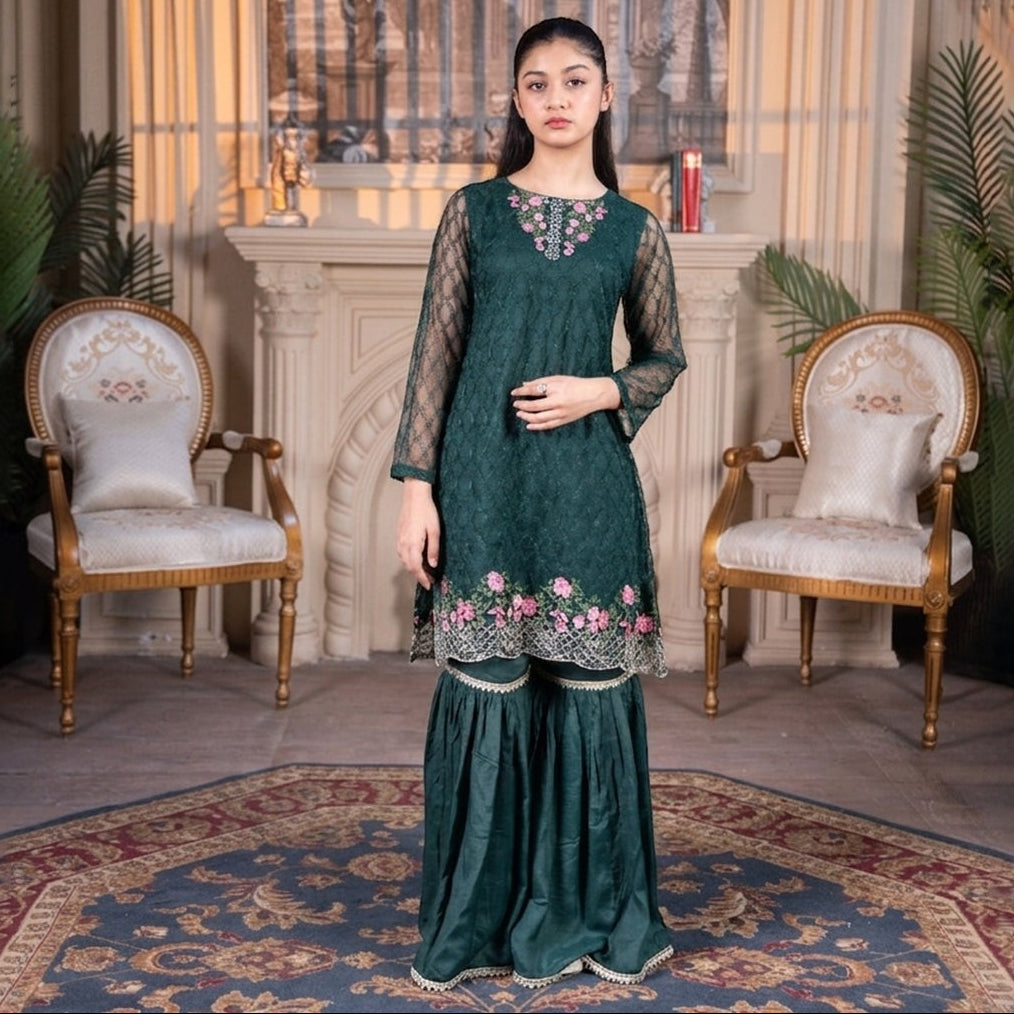 Model wearing Zardham – Trendy Clothing for Girls & Women bottle green net sharara suit with pink floral embroidery.