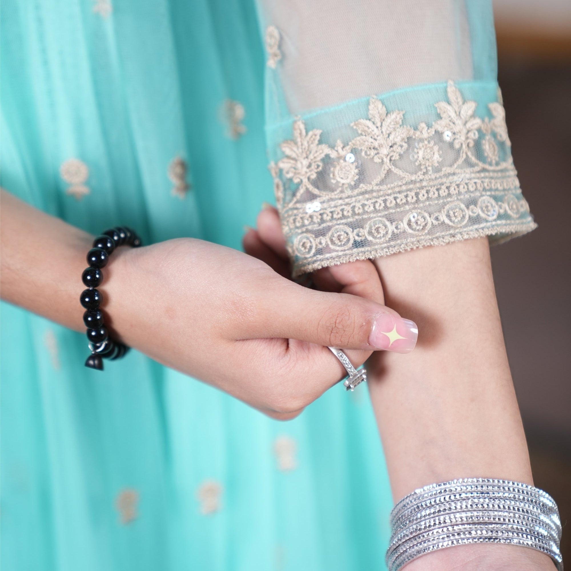 Zardham – Trendy Clothing for Girls & Women mint net frock sleeve with intricate gold floral embroidery and border.