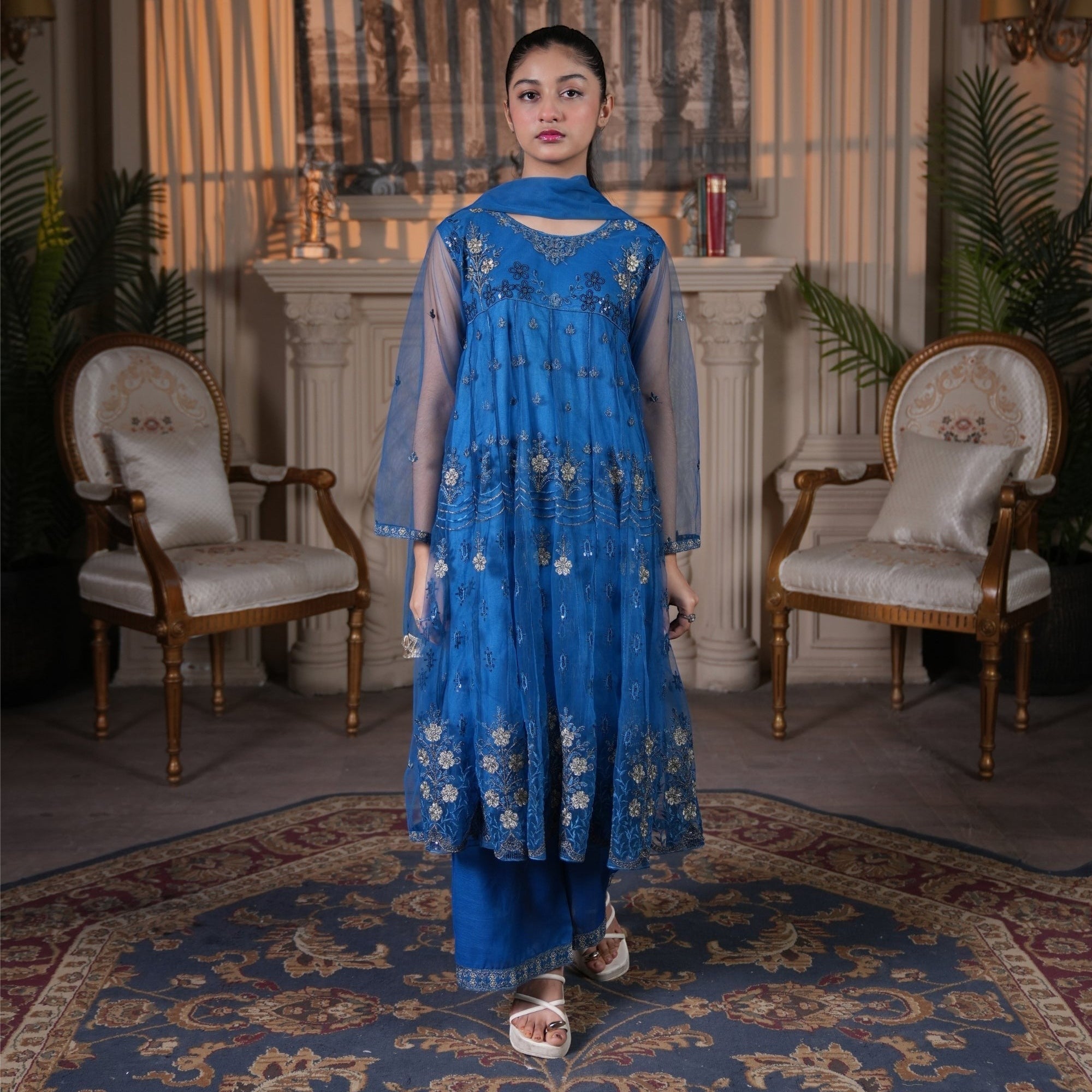 Zardham – Trendy Clothing for Girls & Women royal blue net Anarkali frock with gold and silver floral embroidery.