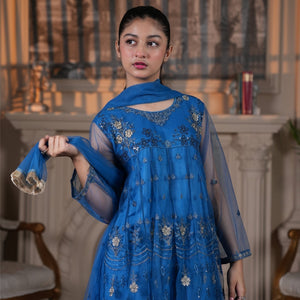 Model wearing Zardham – Trendy Clothing for Girls & Women royal blue net Anarkali with gold and silver floral embroidery