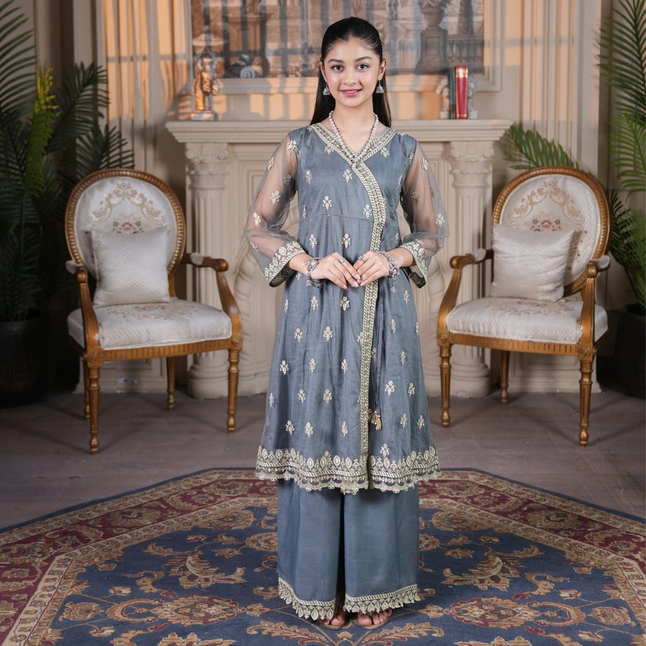Model wearing Zardham – Trendy Clothing for Girls & Women slate grey raw silk angrakha suit with gold embroidery.