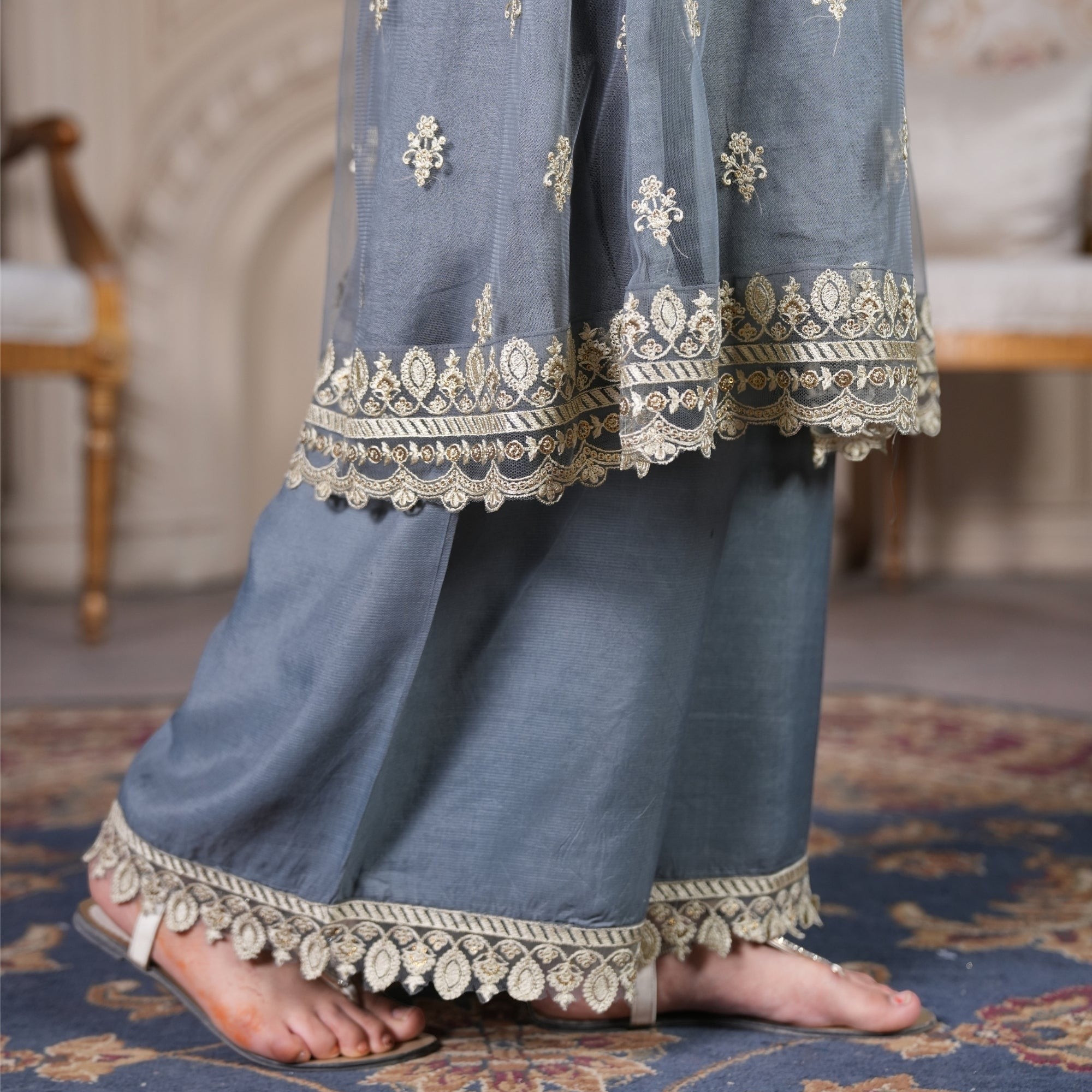 Zardham – Trendy Clothing for Girls & Women slate grey raw silk angrakha suit with gold embroidery and lace borders.